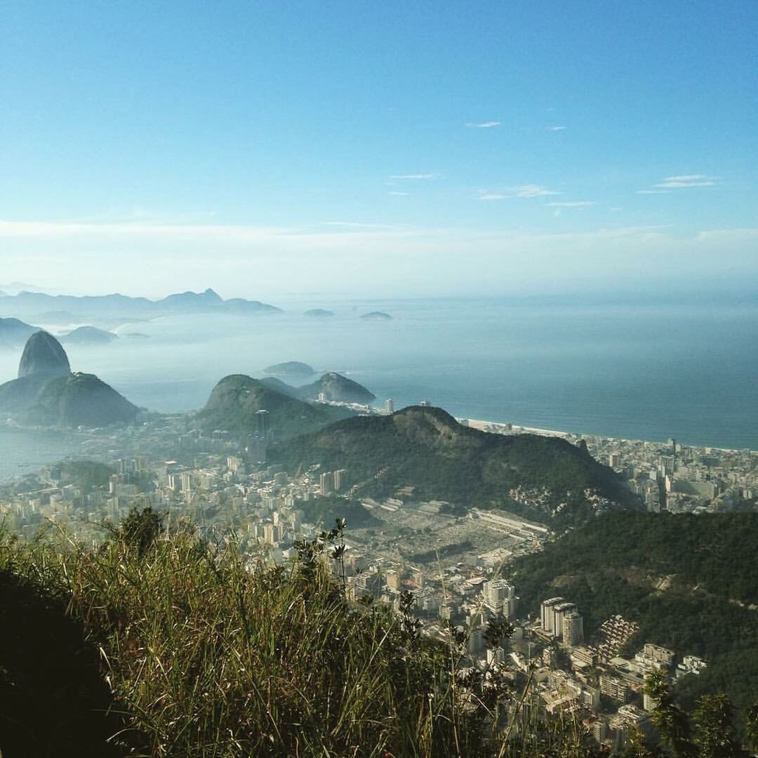 High angle view of calm sea against mountain range