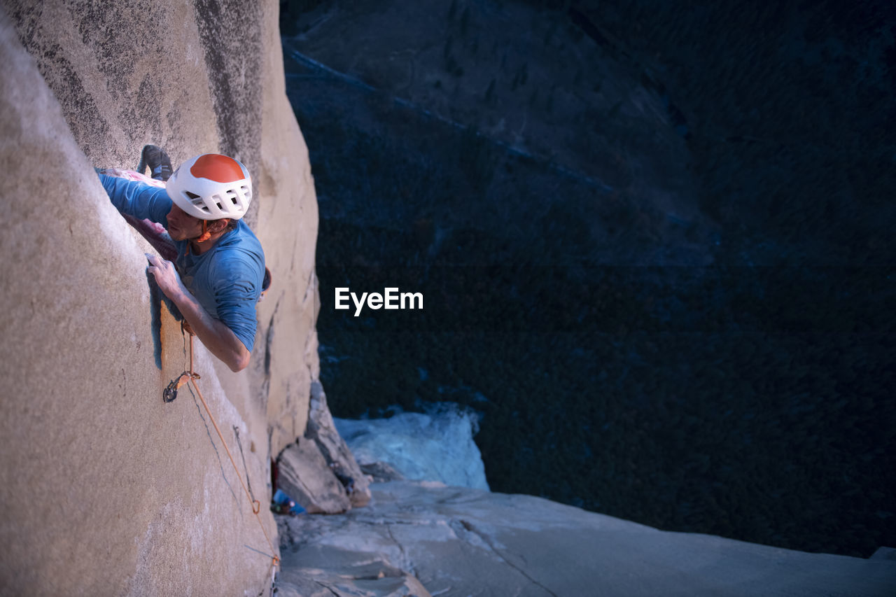 Rock climber crack climbing on the nose, el capitan in yosemite