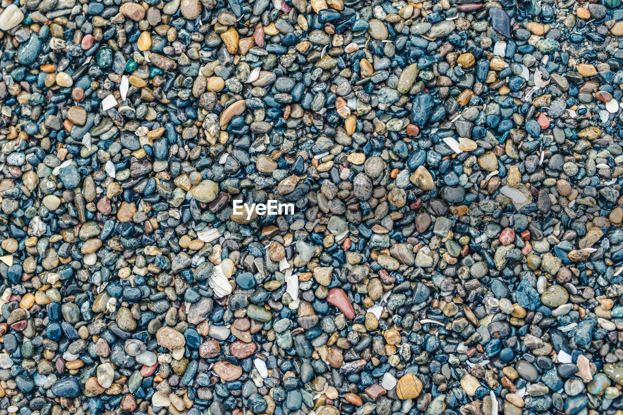 FULL FRAME SHOT OF PEBBLES ON BEACH