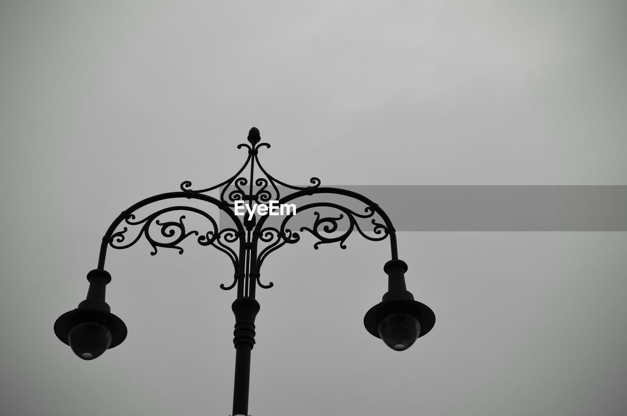 High section of lamp post against clear sky