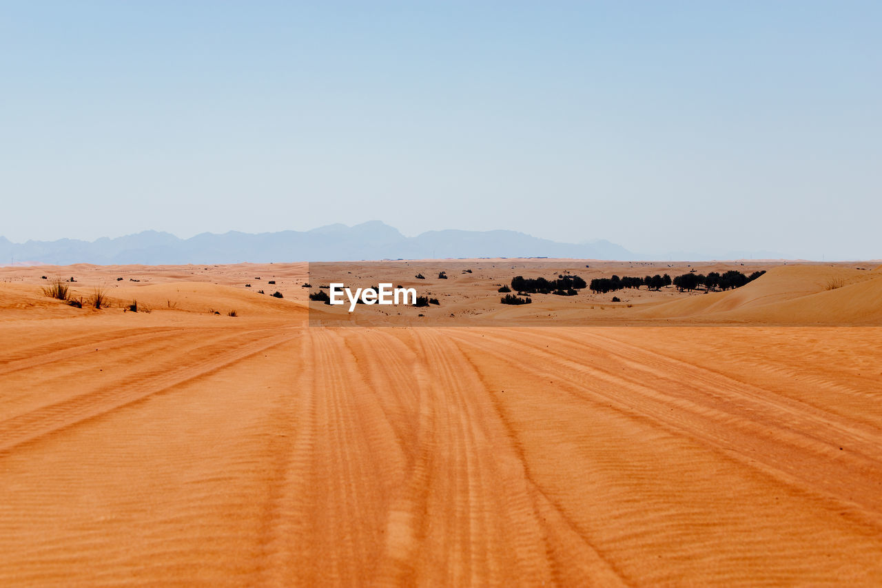 Scenic view of desert against clear sky