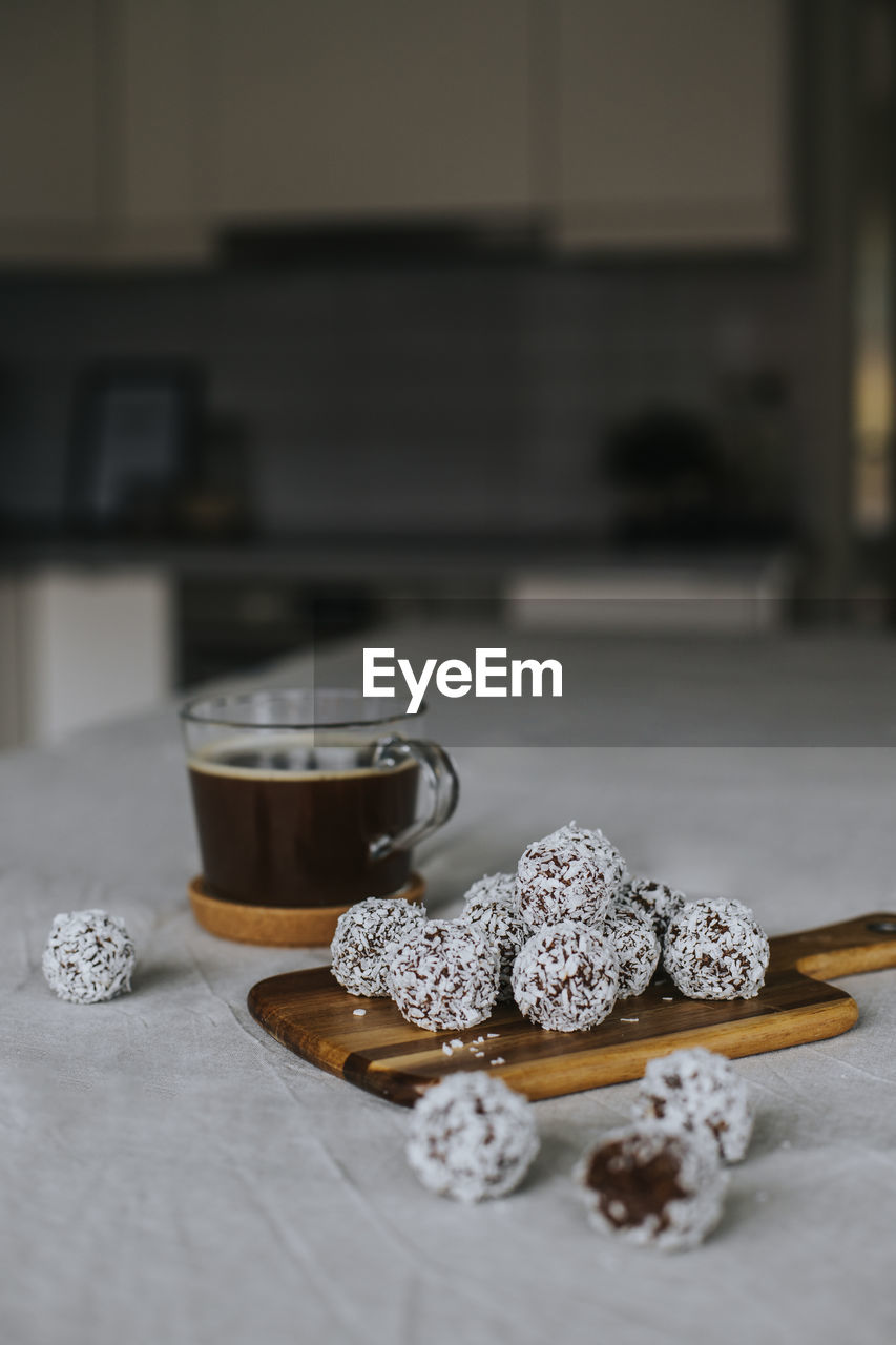 Coffee and balls covered with coconut