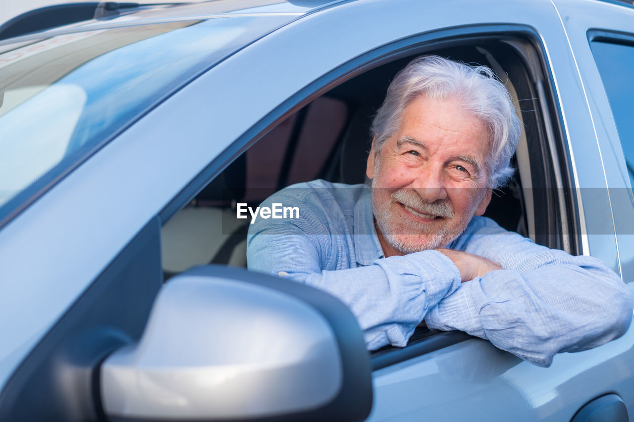 Man leaning on car window