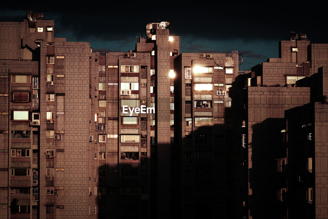 low angle view of buildings in city at night