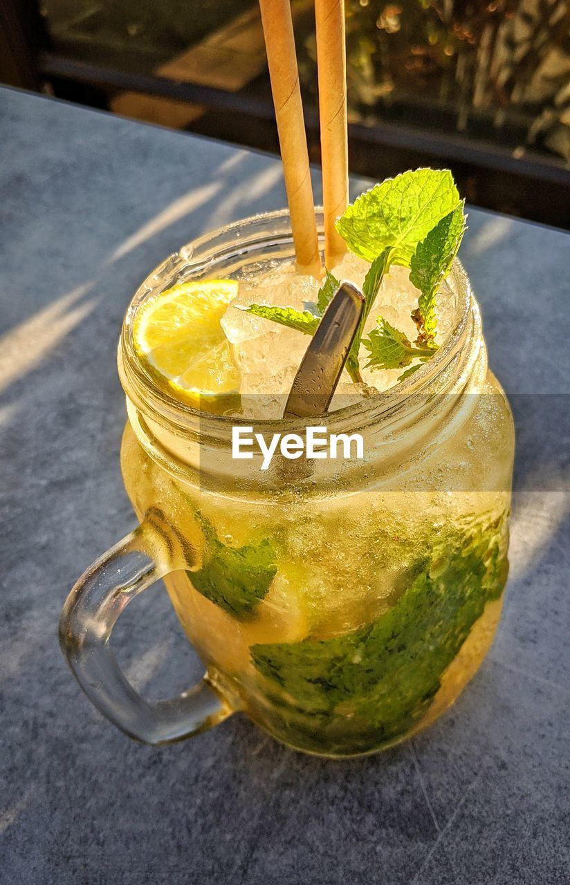 CLOSE-UP OF DRINK IN GLASS JAR