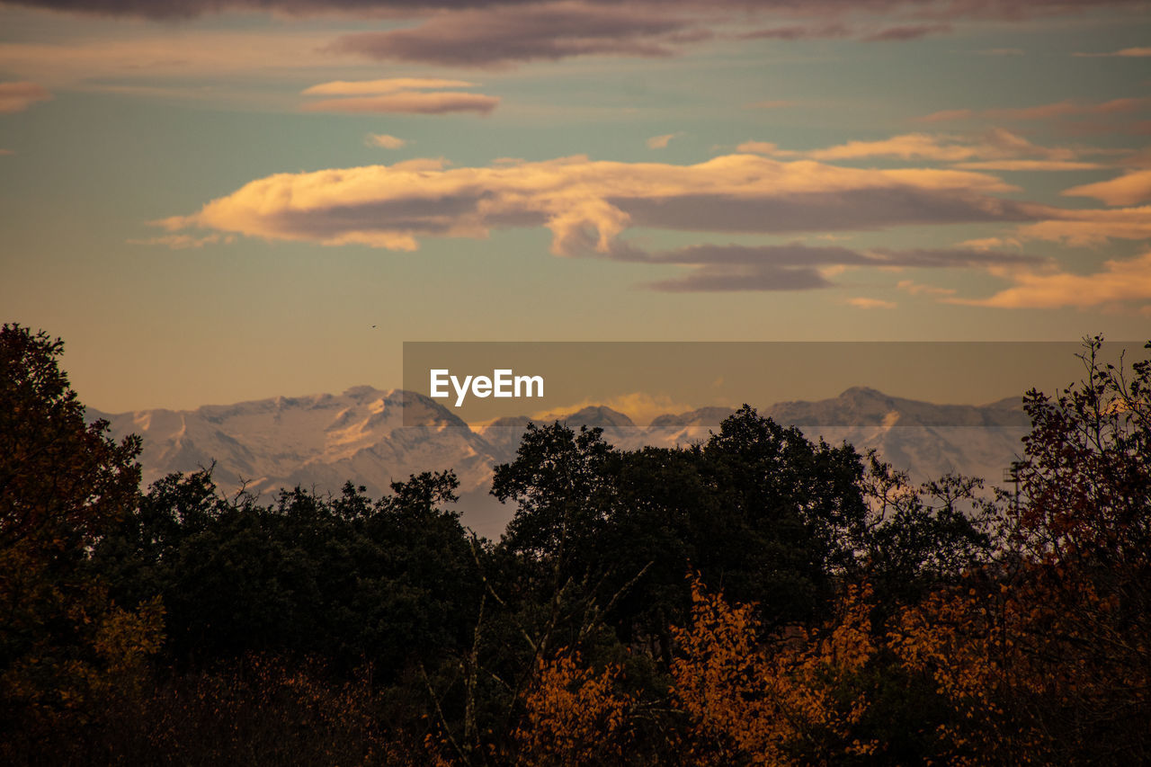 Scenic view of silhouette mountains against sky at sunset