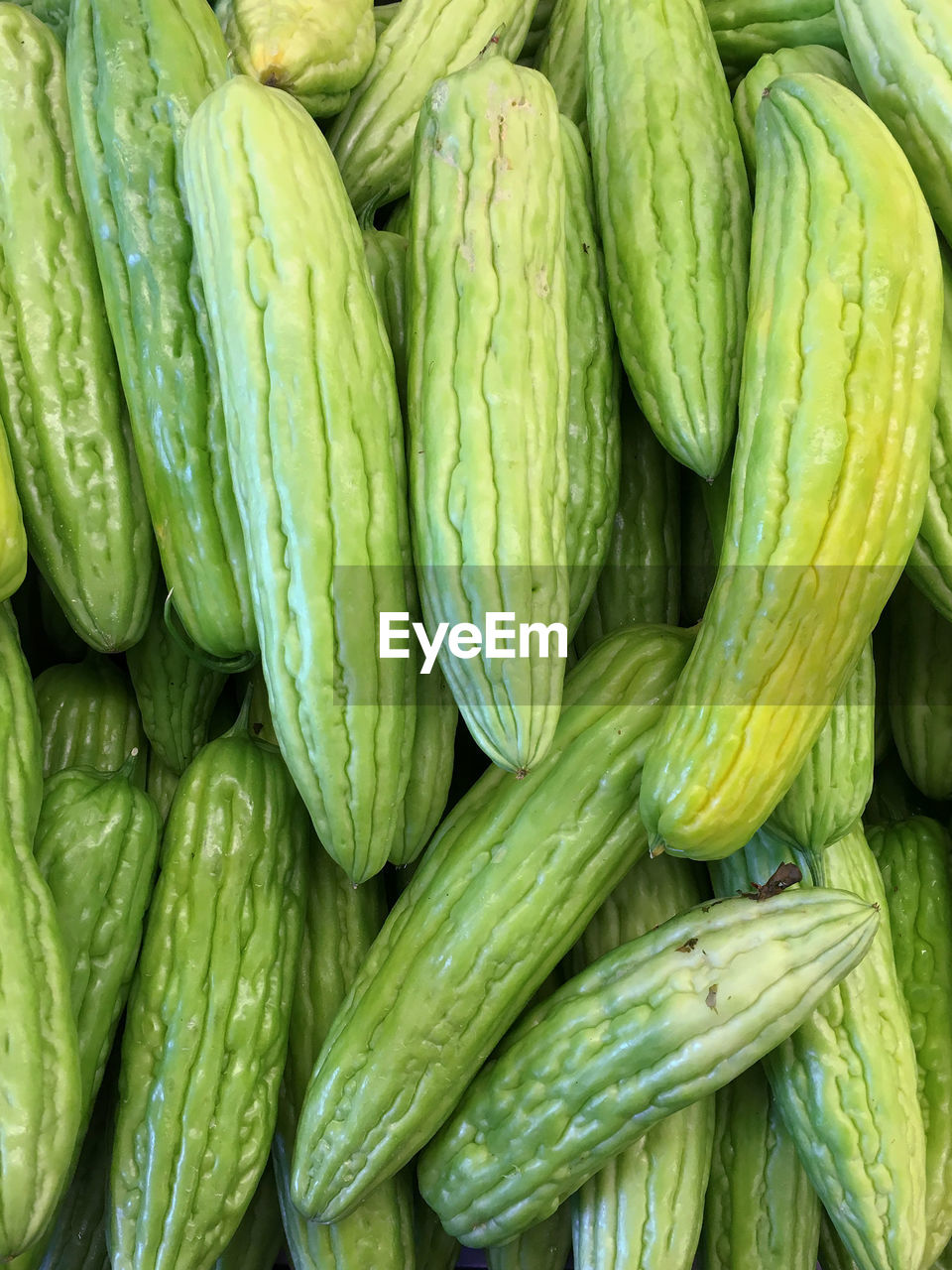 Full frame shot of bitter gourds for sale at market