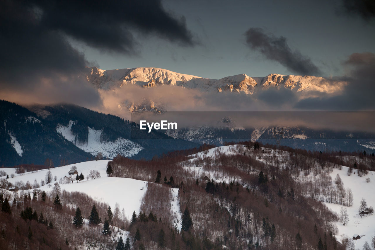 Panoramic view of snowcapped mountains against sky