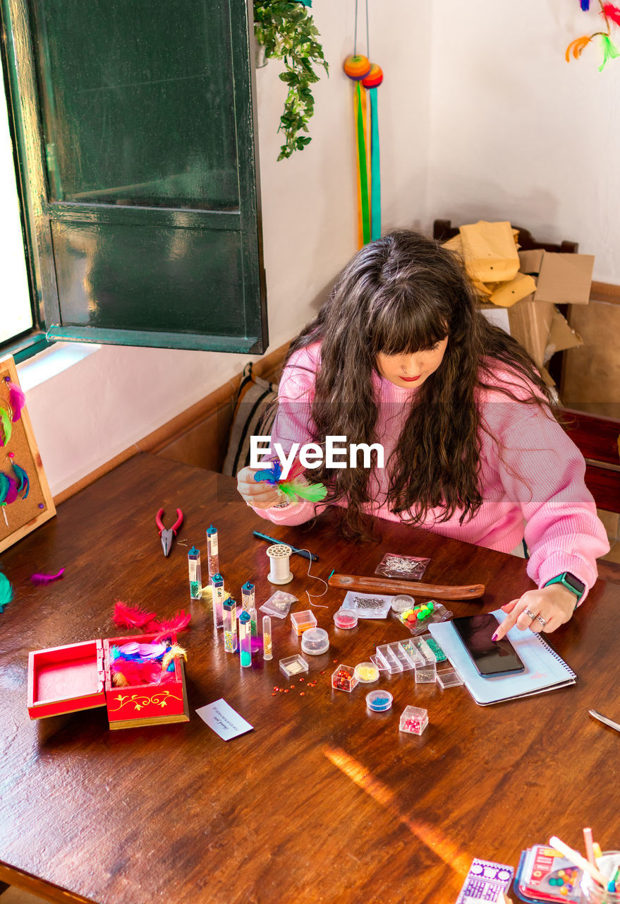 high angle view of girl playing with toy blocks