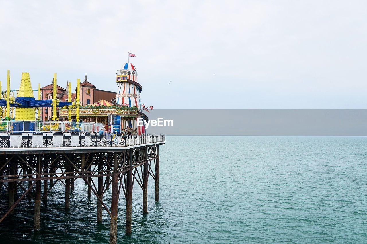 Brighton pier over sea against sky
