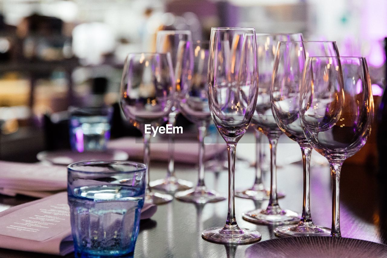 CLOSE-UP OF WINE IN GLASSES ON TABLE