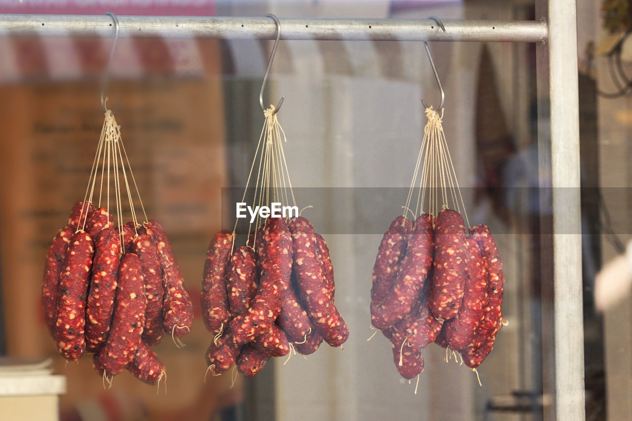 Close-up of meat hanging for sale in market