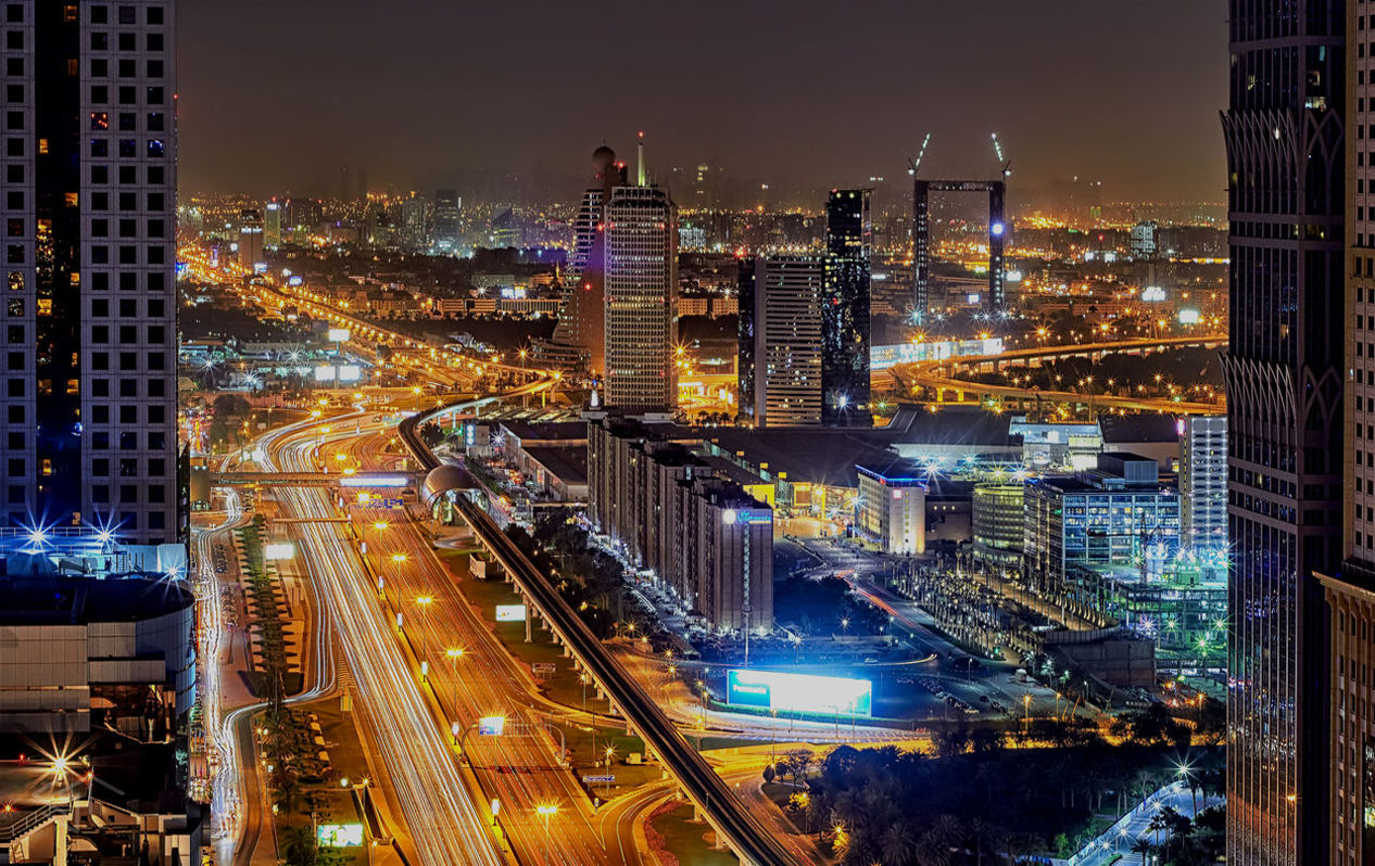 Aerial view of city lit up at night