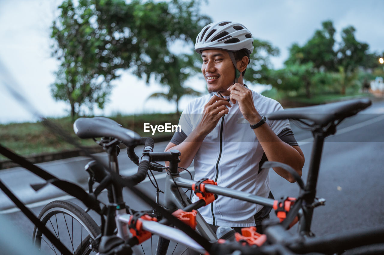 side view of man riding bicycle