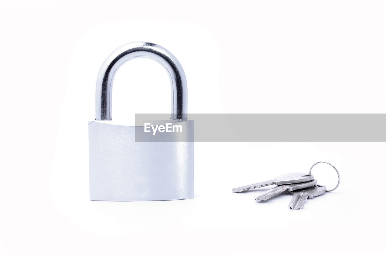 Padlock and keys on white background