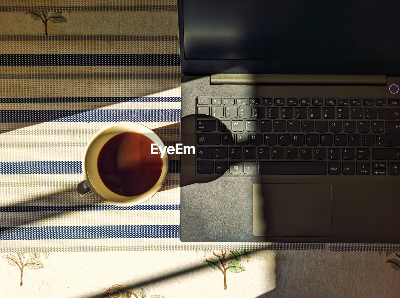 mug, cup, coffee, technology, table, coffee cup, drink, indoors, no people, communication, computer, still life, laptop, wireless technology, food and drink, wood, directly above, keyboard, office supplies, refreshment, computer equipment