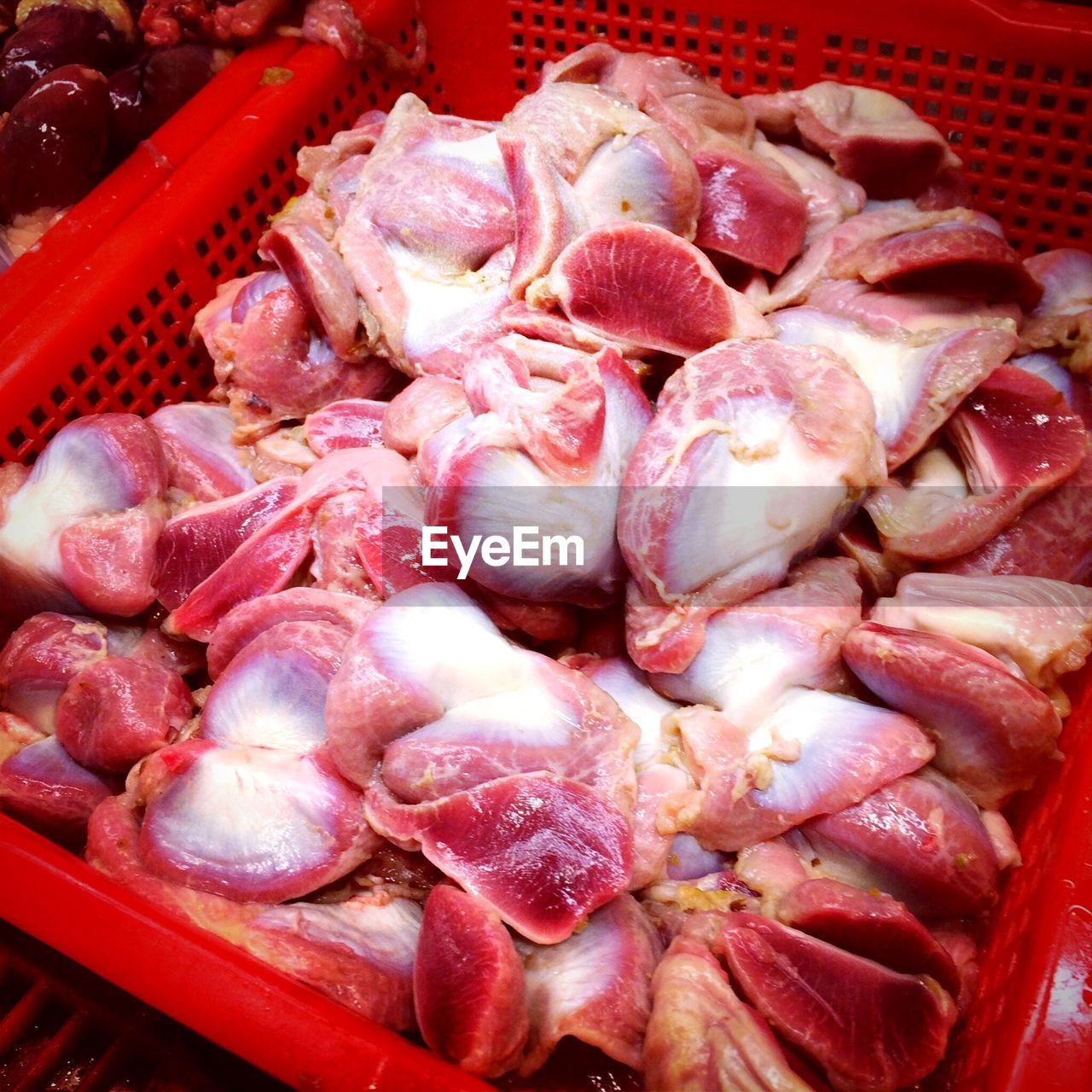 Raw chicken slices in butcher shop