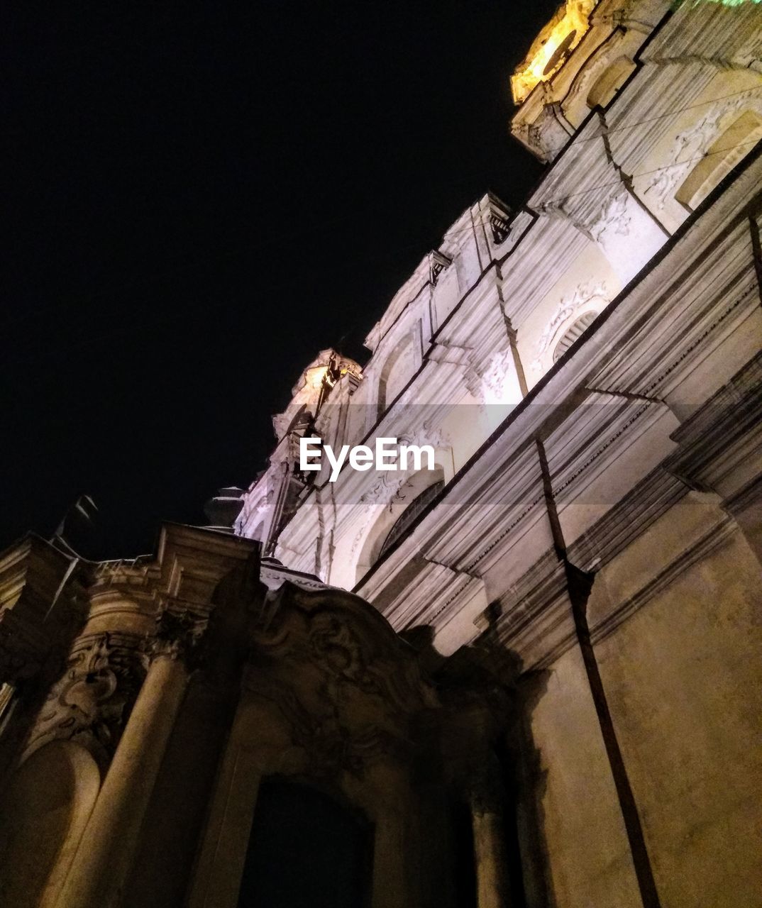 LOW ANGLE VIEW OF ILLUMINATED CATHEDRAL AGAINST SKY