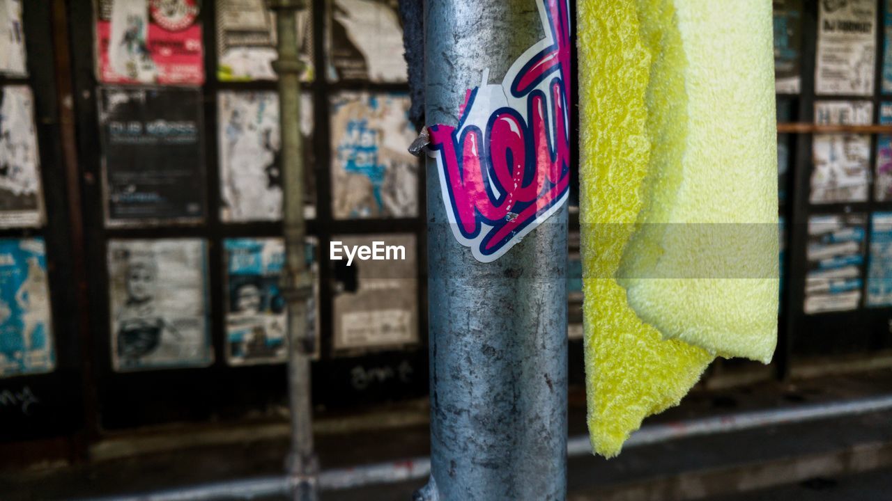 CLOSE-UP OF MULTI COLORED CLOTHES HANGING