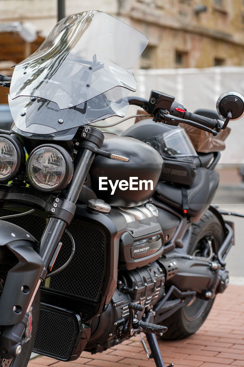 Front view of black motorcycle with helmet on it