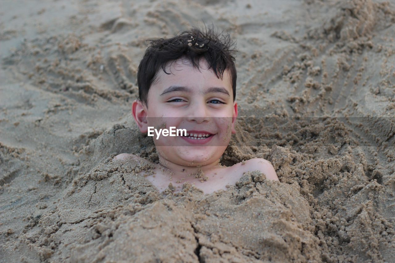 Portrait of smiling boy on beach