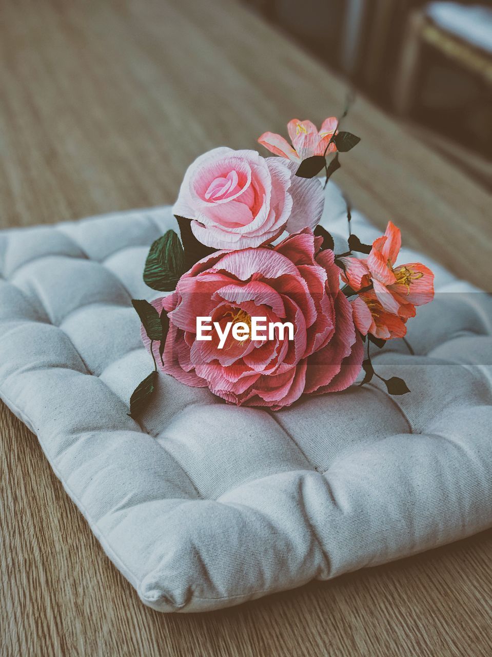 CLOSE-UP OF ROSES ON TABLE