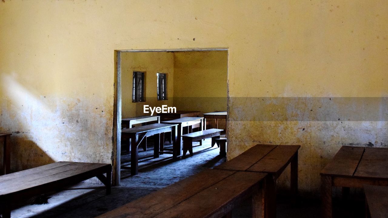 EMPTY CHAIR AND TABLE IN BUILDING