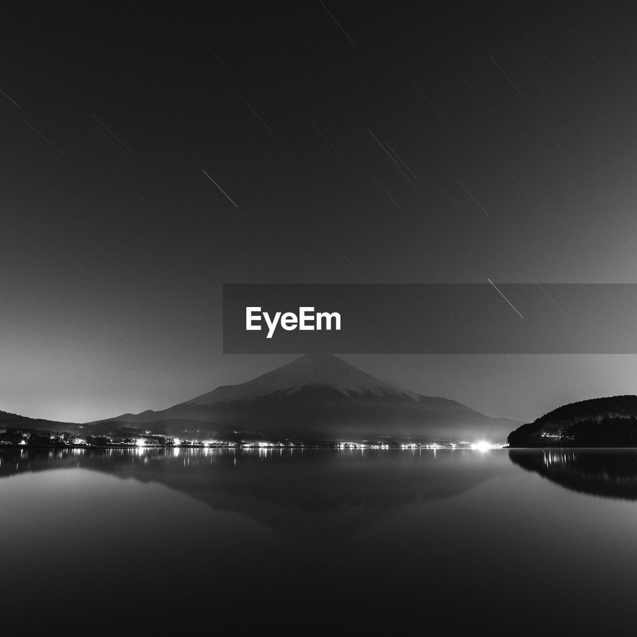 Night shot of mount fuji from lake yamanaka, yamanashi prefecture, japan