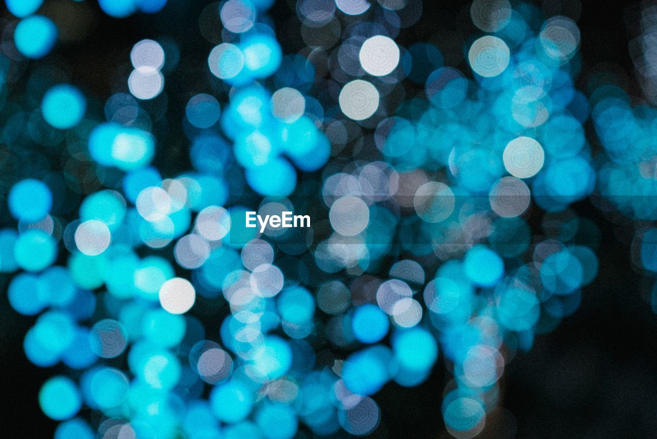 Defocused image of illuminated blue lights