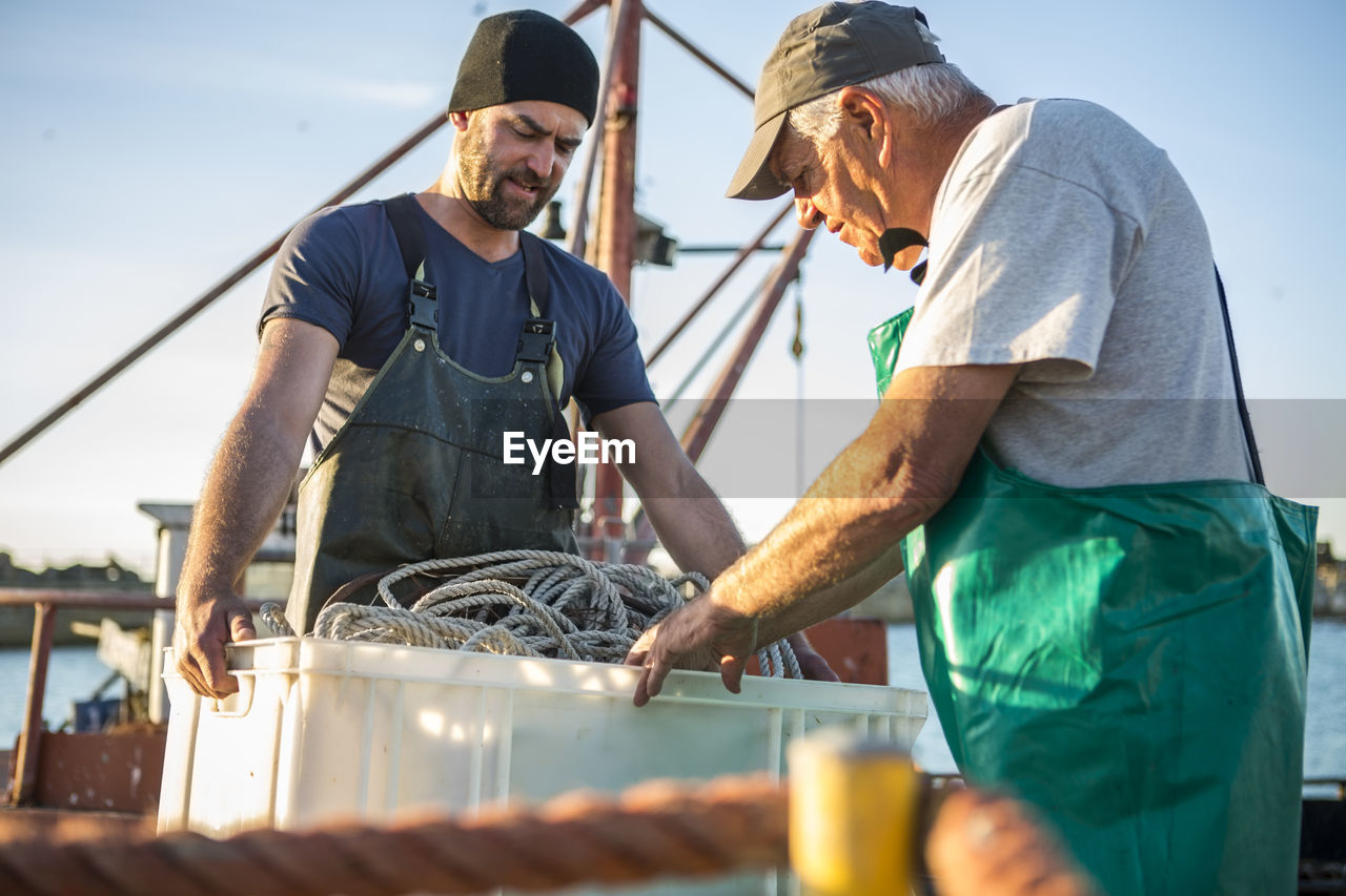 Fishermen working on trawler