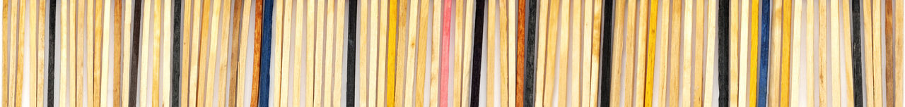 Multicolored matchsticks on white paper