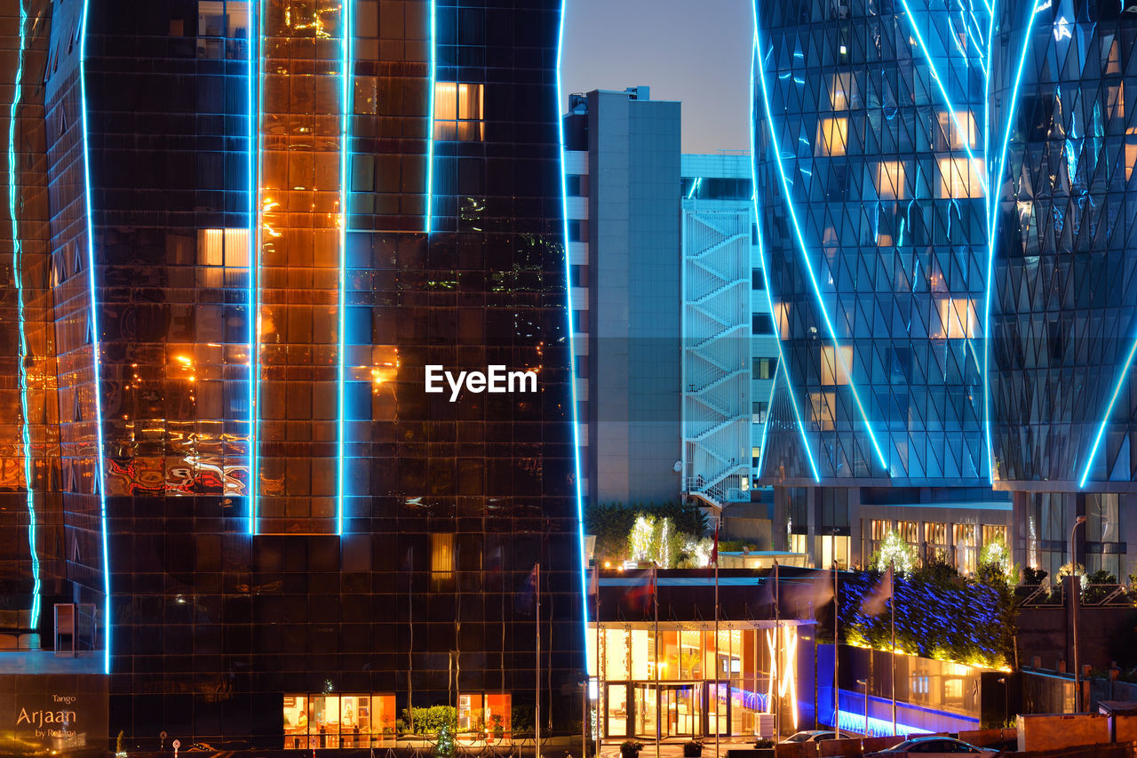 ILLUMINATED MODERN BUILDING AT NIGHT