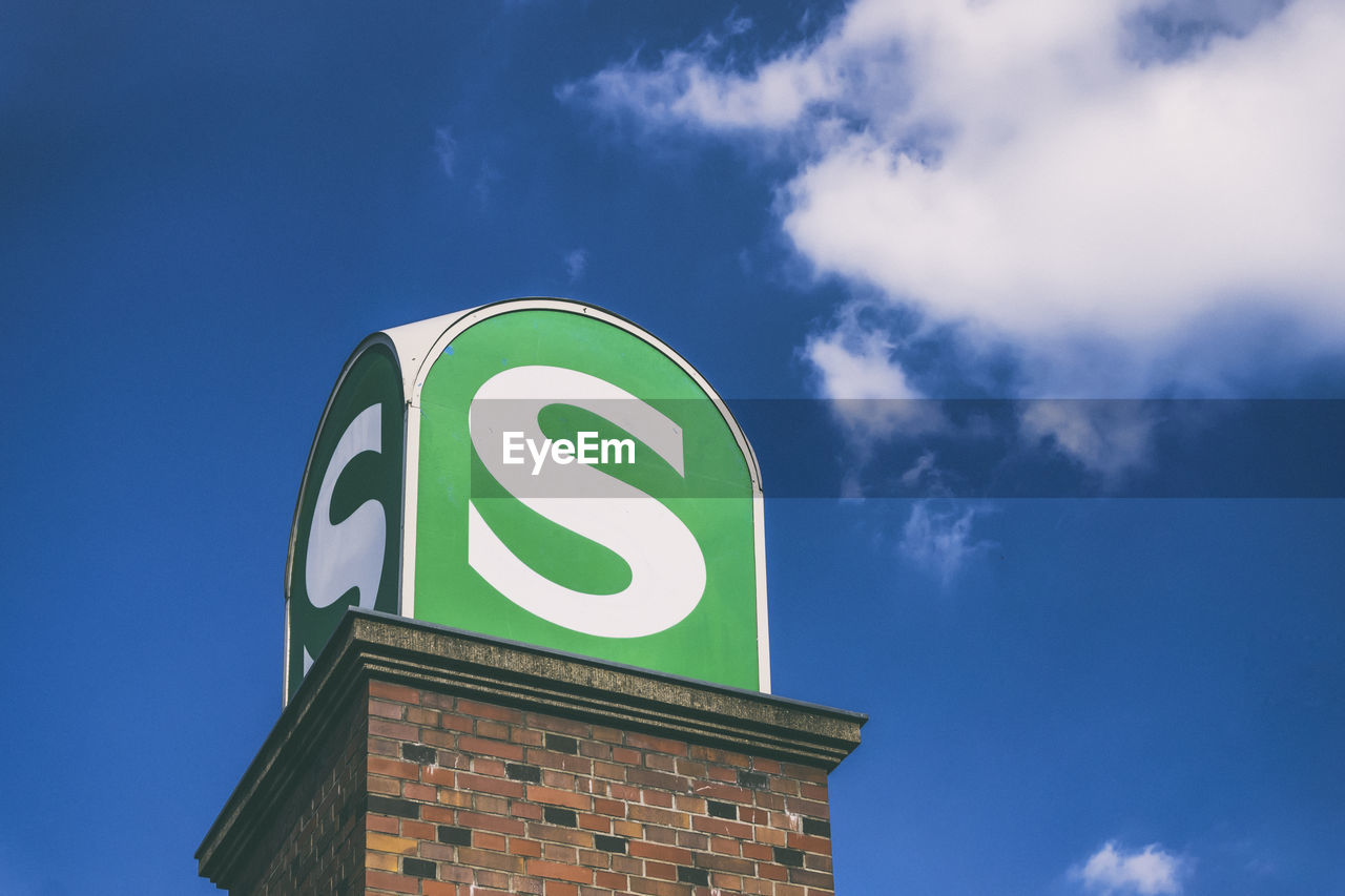 LOW ANGLE VIEW OF SIGN AGAINST SKY