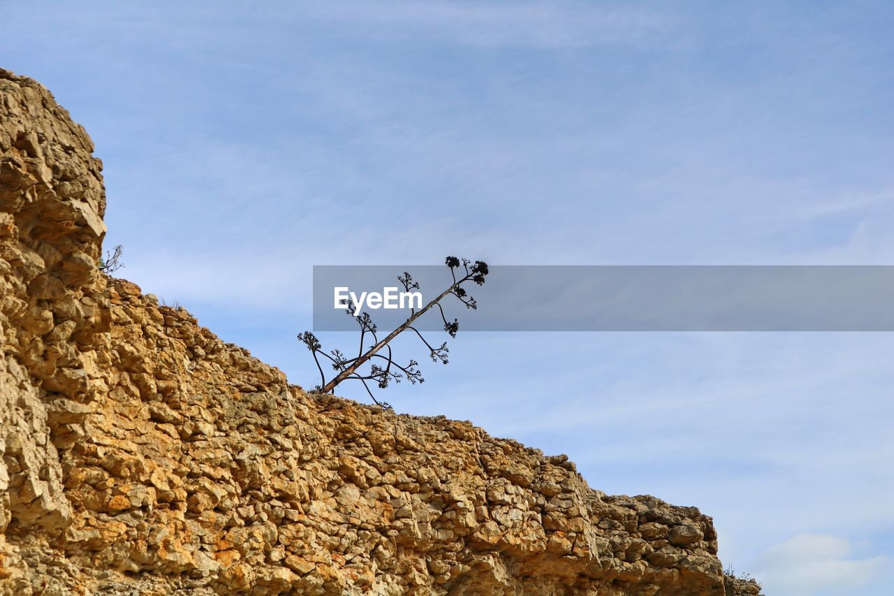 LOW ANGLE VIEW OF ROCK FORMATIONS