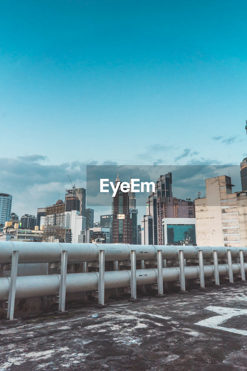 VIEW OF BUILDINGS IN CITY AGAINST SKY