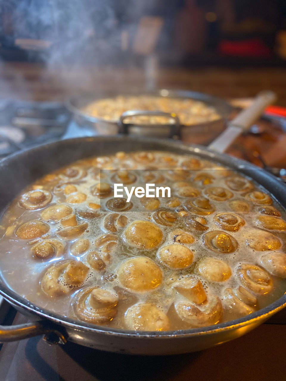 Close-up of  mushrooms in cooking pan
