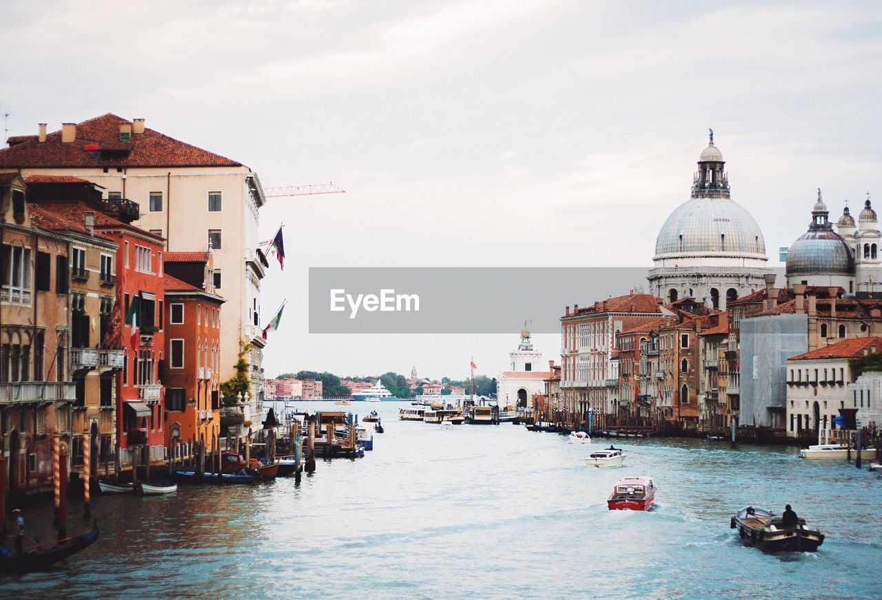 Santa maria della salute by grand canal against sky