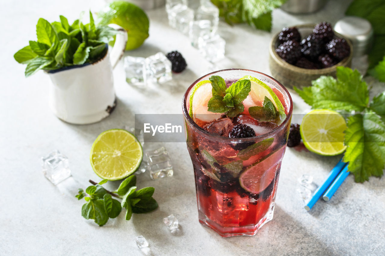 Summer blackberry mojito or blackberry soda. refreshing summer drink with blackberry, mint. 