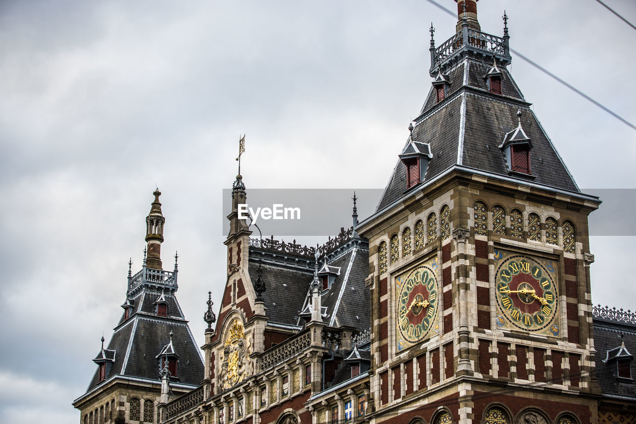 Low angle view of amsterdam central station against sky