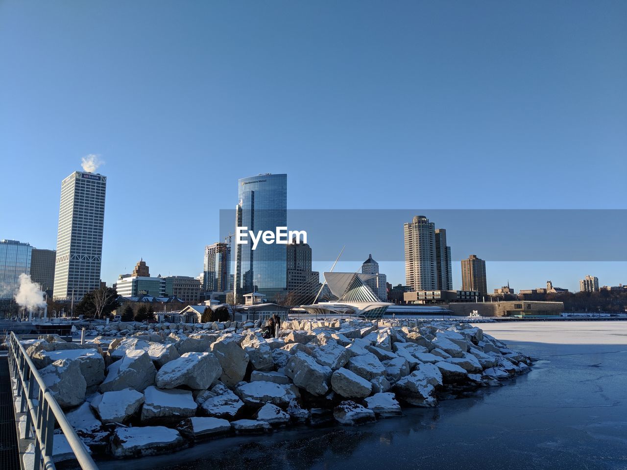 Modern cityscape against clear blue sky