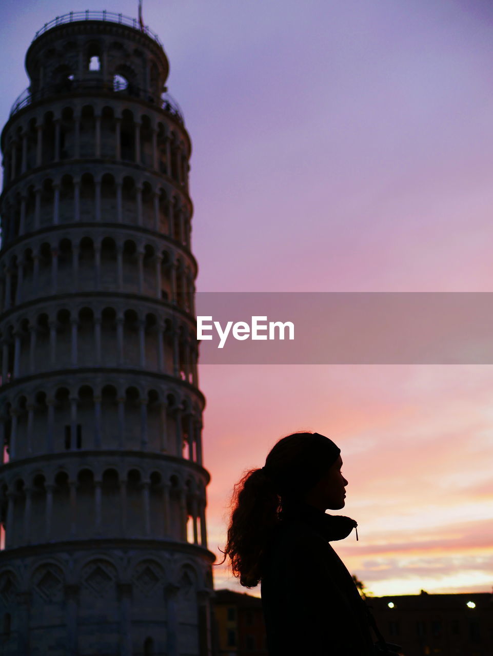 LOW ANGLE VIEW OF WOMAN AGAINST SKY