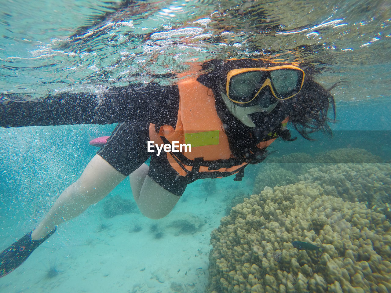 WOMAN SWIMMING IN SEA