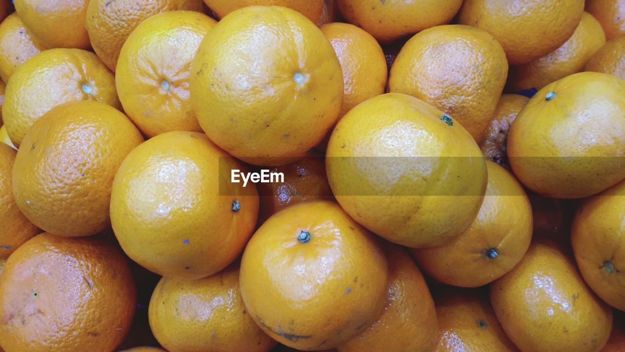 Full frame shot of oranges for sale at market stall