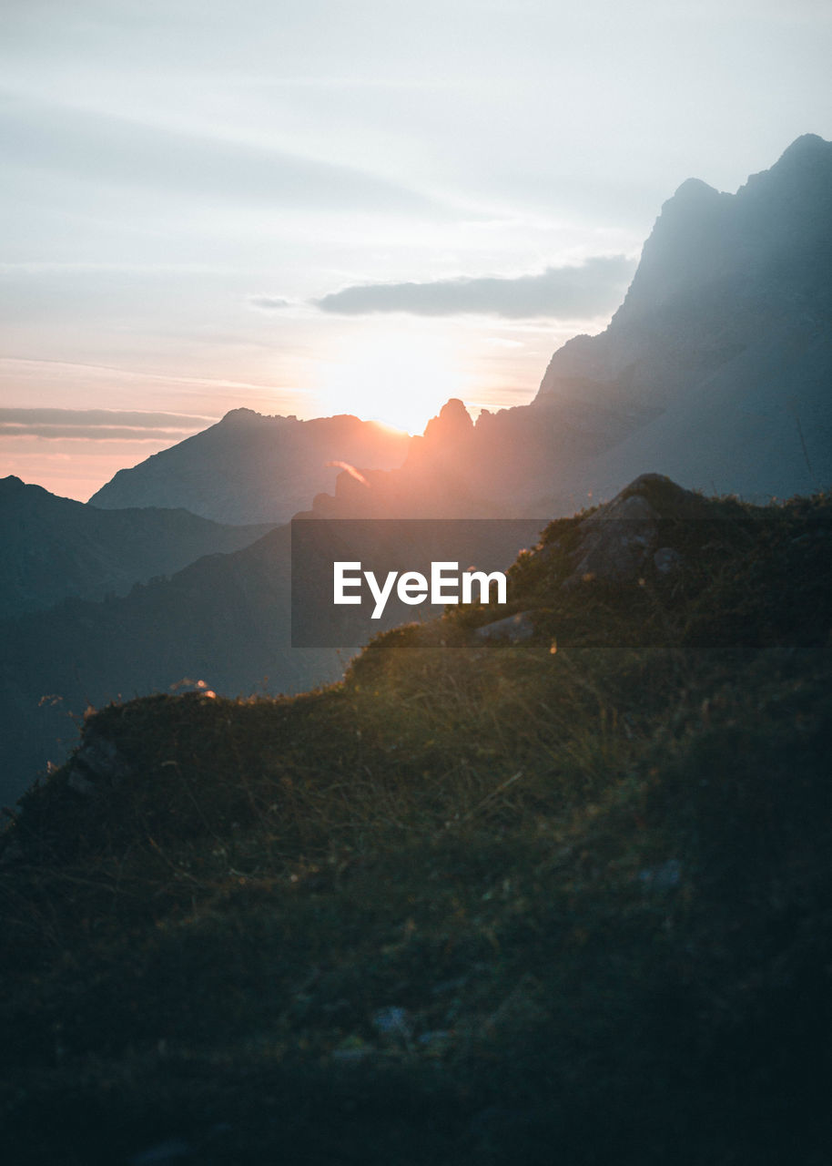 Scenic view of mountains against sky during sunset