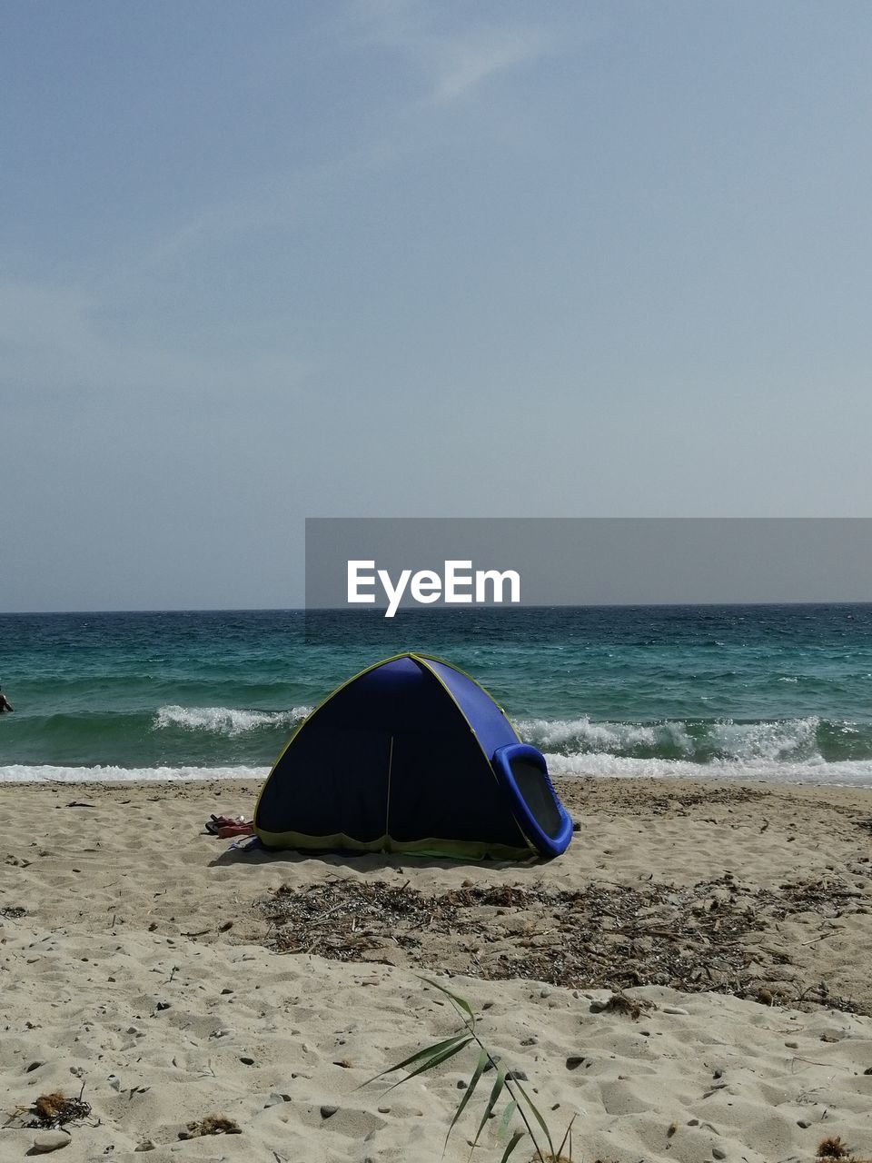 Tent on beach against sky