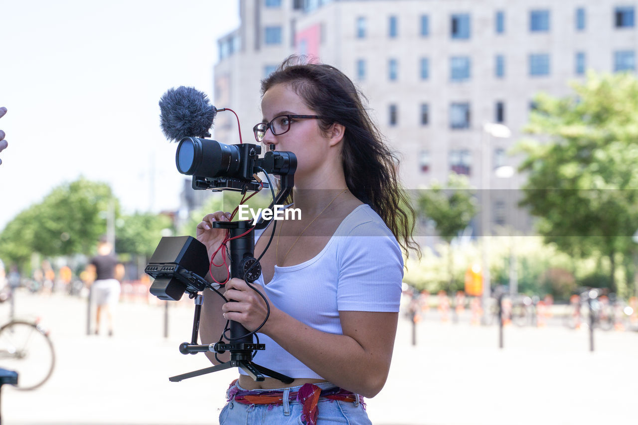 Young woman on camera with gimbal