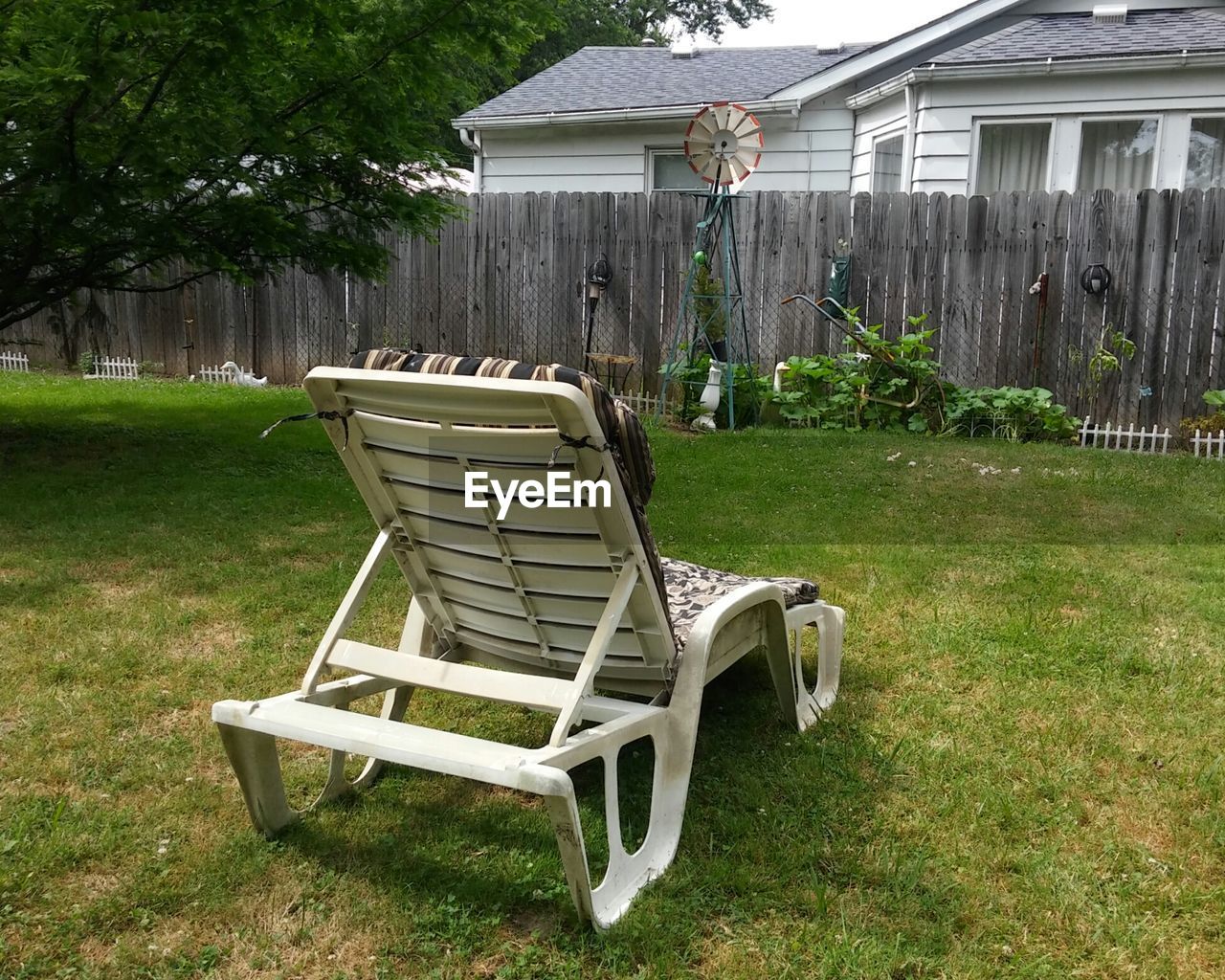 Chairs on lawn in yard