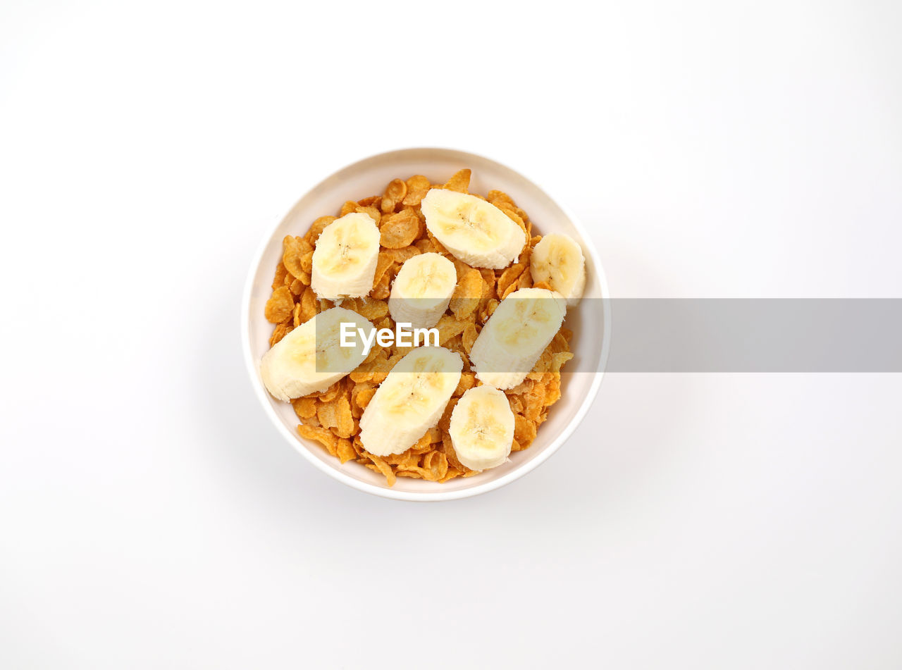 HIGH ANGLE VIEW OF BREAKFAST SERVED ON WHITE BACKGROUND