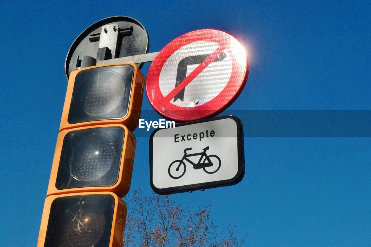 A traffic sign says no right turn except for bikes