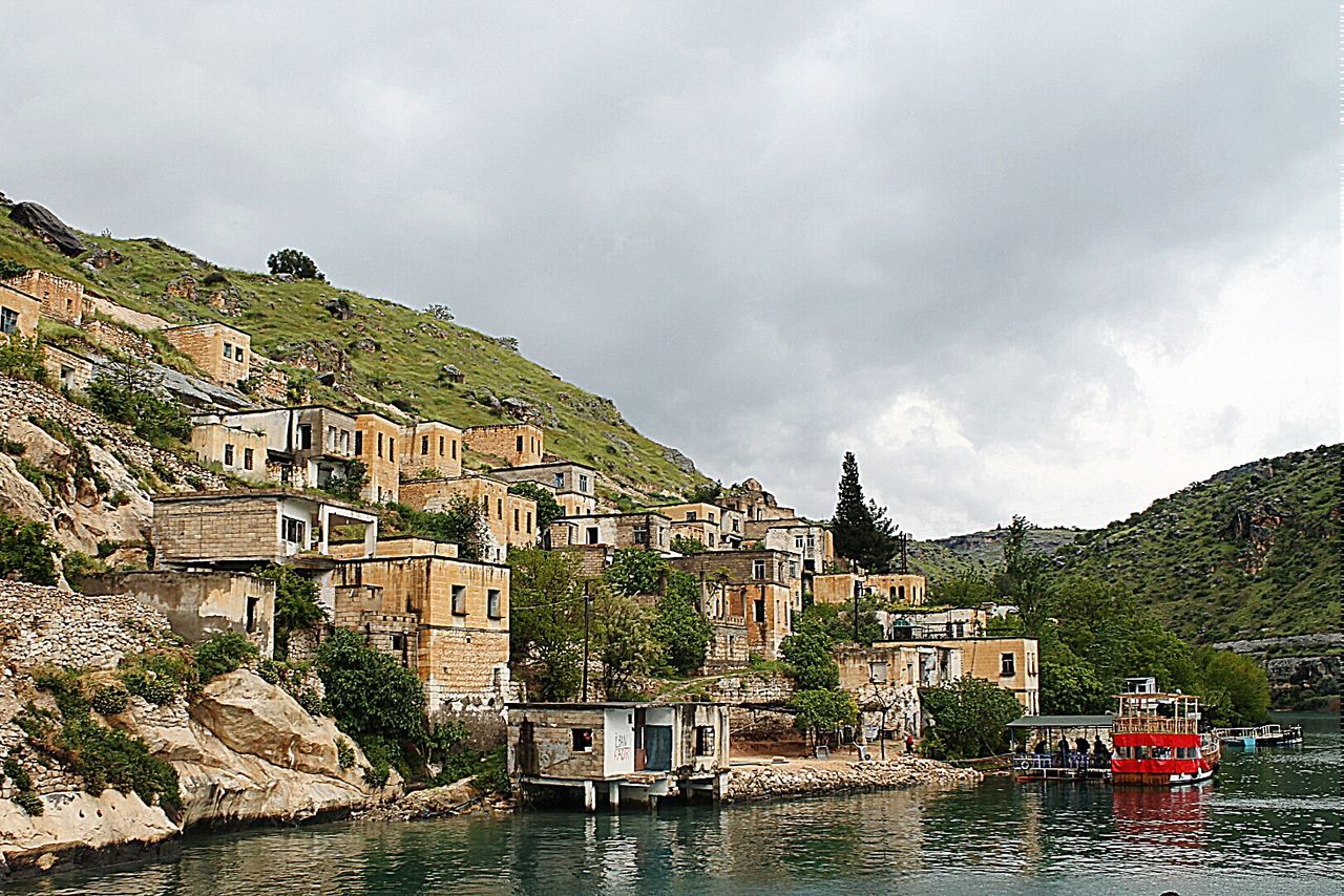 RIVER WITH BUILDINGS IN BACKGROUND